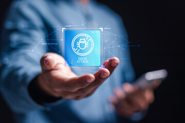 DDoS attack concept. Businessman holding virtual DDOS warning sign for online attack. Attacking the target website, Botnet malware that lurks on internet servers
