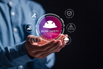 Work safety concept. Businessman hold virtual safety icon for working standard process and zero...