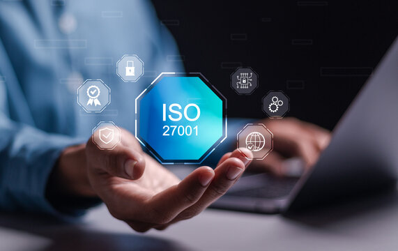 ISO 27001 concept. Businessman use laptop with virtual ISO 27001 icon for information security management system (ISMS). requirements, certification, management, standards.