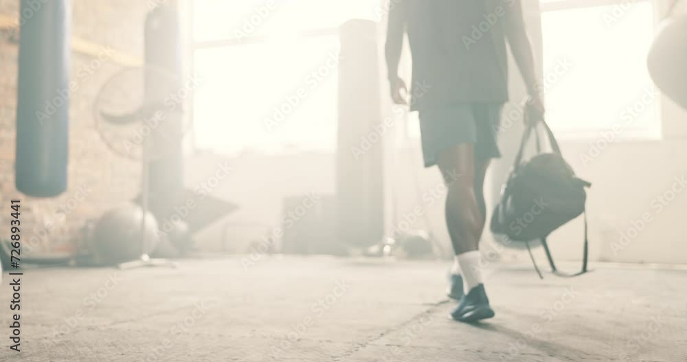 Sticker Man, gym and walking with bag for training, workout and exercise of personal trainer and blurred background. Coach, wellness and ready for sport, boxing and fight routine with luggage at fitness club