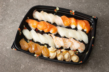 Different types of sushi on a plate	