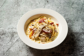 Bacon cheese pasta on plate	