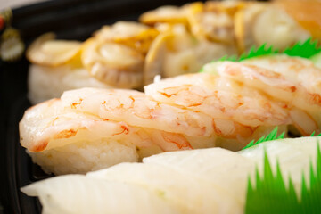Different types of sushi on a plate	