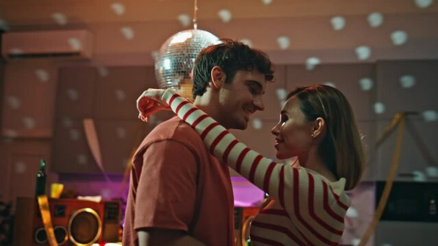Happy lovers dancing party in empty apartment close up. Romantic couple date 