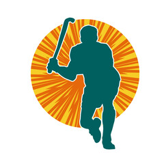 Silhouette of male field hockey athlete in action. Silhouette of a man playing field hockey sport.