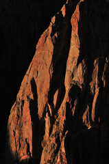Sunset on the deep, sheer walls of the Black Canyon of the Gunnison National Park, Colorado, USA.