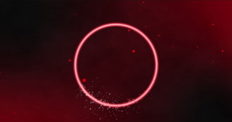 Image of neon circle over red and black digital space with dots