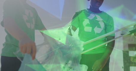 Image of networks over happy diverse schoolboys in recycling t shirts collecting waste
