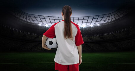 Image of caucasian female soccer player over stadium