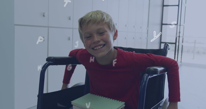 Image of letters over happy caucasian schoolboy in wheelchair