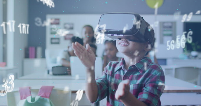 Image of data processing over happy biracial schoolboy using vr headset class