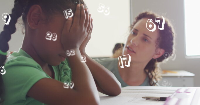 Image of data processing over diverse female teacher comforting sad schoolgirl in class
