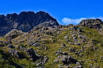 Agulhas Negras, or Black Needles peak (2.791m), one of the highest in Brazil, towering above the boulder-filled high plateau of Itatiaia National Park, Itatiaia, Rio de Janeiro, Brazil.