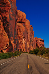 Red sandstone cliffs on the Utah State Route 279, the Lower Colorado River Scenic Byway U-279, or...