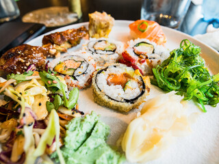 Sushi platter with maki, nigiri and wakame