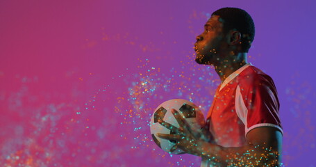 Image of african american male soccer player over spots