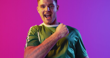 Image of caucasian male soccer player over data processing