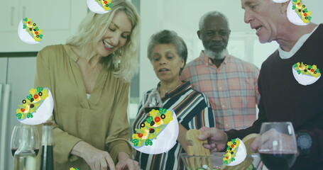 Image of salad icons over diverse group of seniors cooking