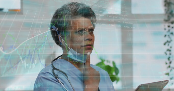 Image of data processing over african american female doctor with tablet