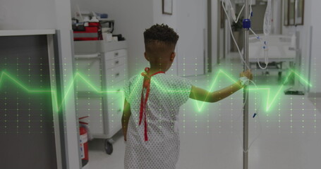 Image of medical data processing over biracial boy patient with drip