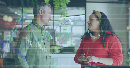 Image of data processing over diverse business people working at office