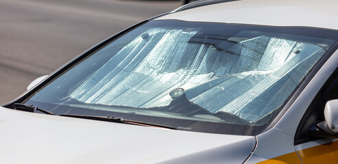 Reflective sun protection on car windshield
