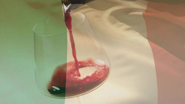Composite of red wine being poured into glass over flag of italy background