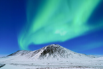 Aurora borealis on the Lofoten islands, Norway. Northern Lights over the mountains. Scandinavia....