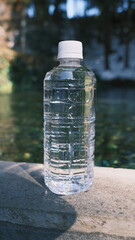 bottle of water by the fresh water spring