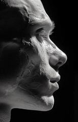 Creative close-up portrait of a man on a dark background, studio lighting.