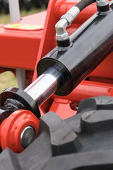 Black piston or actuator and black tyre as part of pneumatic or hydraulic machine. Technology