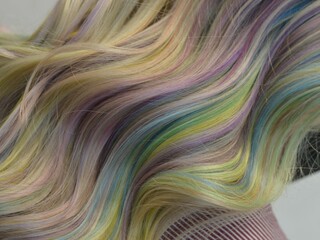 abstract colorful background up close photo of pastel rainbow hair
