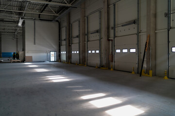 Warehouse gates and doors in darkness dropping shadows