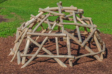 Wooden climbing dome in playground