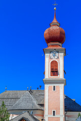 Bell tower of Parish church of St. Ulrich in Ortisei. South Tyrol, Italy