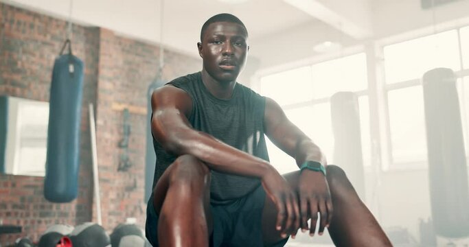 Fitness, gym and face of tired black man breathing after training, workout or intense exercise. Health, portrait or African bodybuilder sweating at sports center for athlete, resilience or challenge