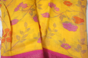 indian traditional saree or sari made of different material like silk, cotton, raw silk, tussar silk etc.,