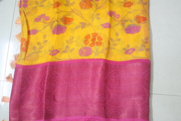 indian traditional saree or sari made of different material like silk, cotton, raw silk, tussar silk etc.,