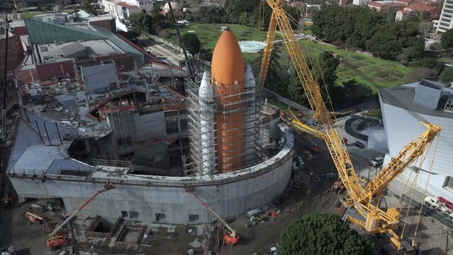 Construction site of Endeavor Space Shuttle, rocket boosters and tank are assembled, space shuttle waiting in the distance, aerial view