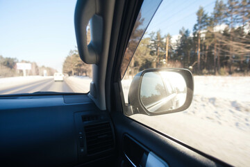 Car mirror, view from inside. In move