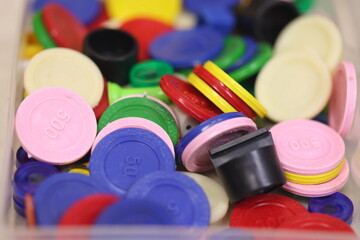 pegs and play coins meant for games like business, Chinese checkers, uno etc., - obrazy, fototapety, plakaty