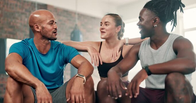 Fitness coach, group of people and gym for workout, training and teamwork with break, talking and planning together. Sports friends, woman and men in diversity and discussion of exercise or support