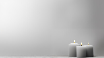 Minimalist Sympathy Condolences Grief card. Three burning candles on a muted light grey background. Copy space.