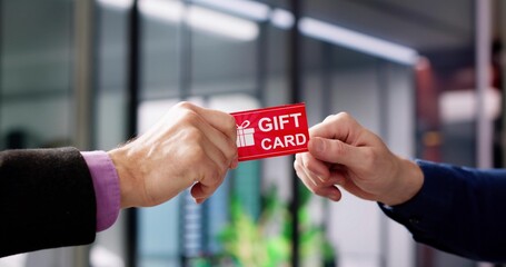 Hand Giving Gift Voucher Card