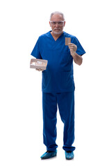 Old male doctor suggesting pills isolated on white