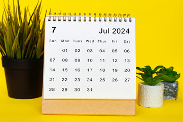 July 2024 calendar with yellow over background. Monthly calendar concept