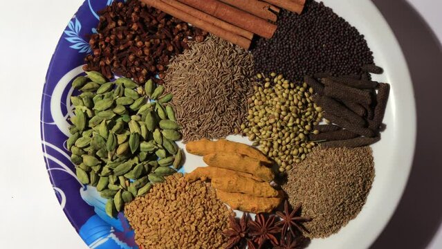 Dried spices table top spin close up.