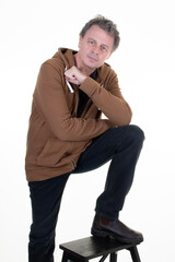 man happy portrait of confident smiling handsome middle aged full in brown hoodie on white background