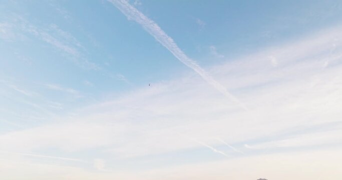 Drone Shot of Sunny LA in Daytime, Helicopter in Bright Blue Sky with Businesses and Luxury Homes Below