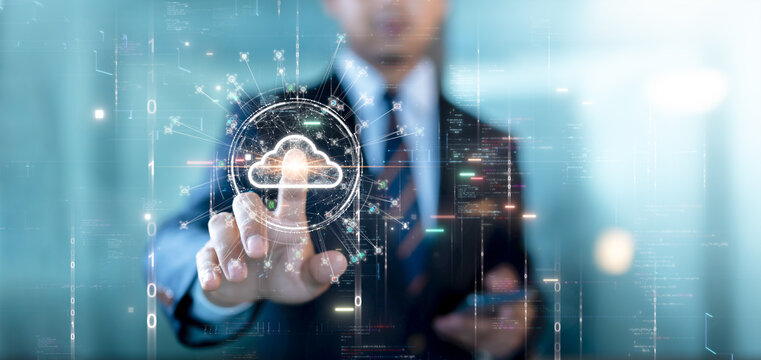 Cloud or edge computing technology concept. Businessman is using his fingers to select a cloud icon connecting accessing global usage data. Abstract binary code on background.